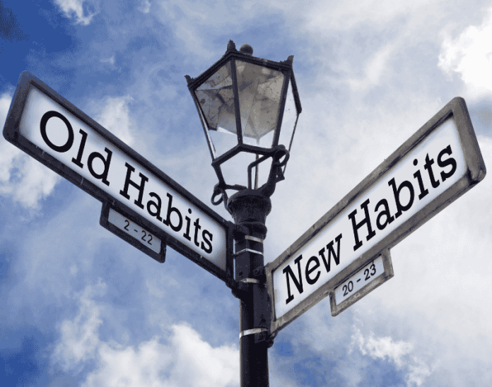 sign showing old habits and new habits ways